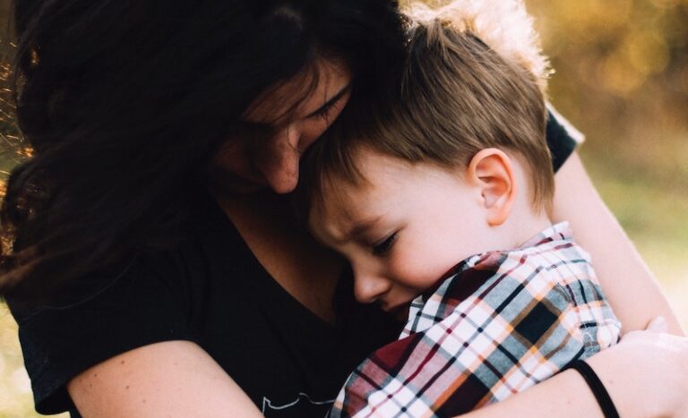 Mom comforting child: parents with anxiety