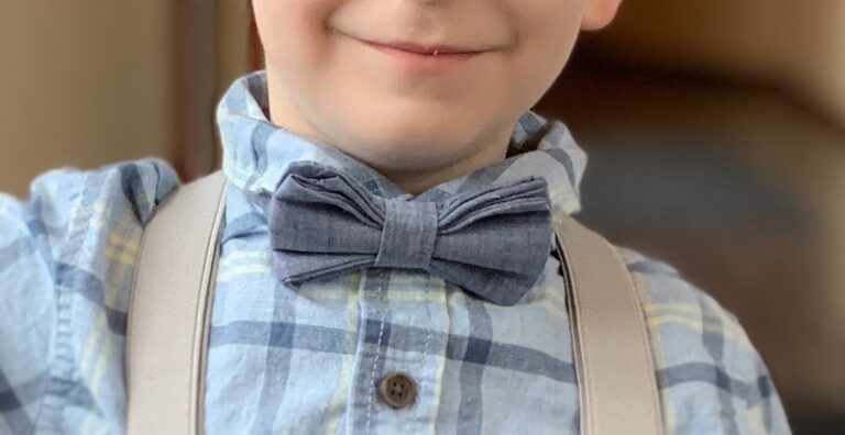 A young boy wearing a bow tie