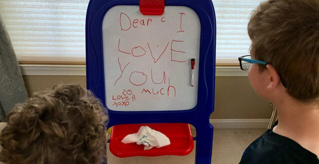 My son's white board message to his little brother